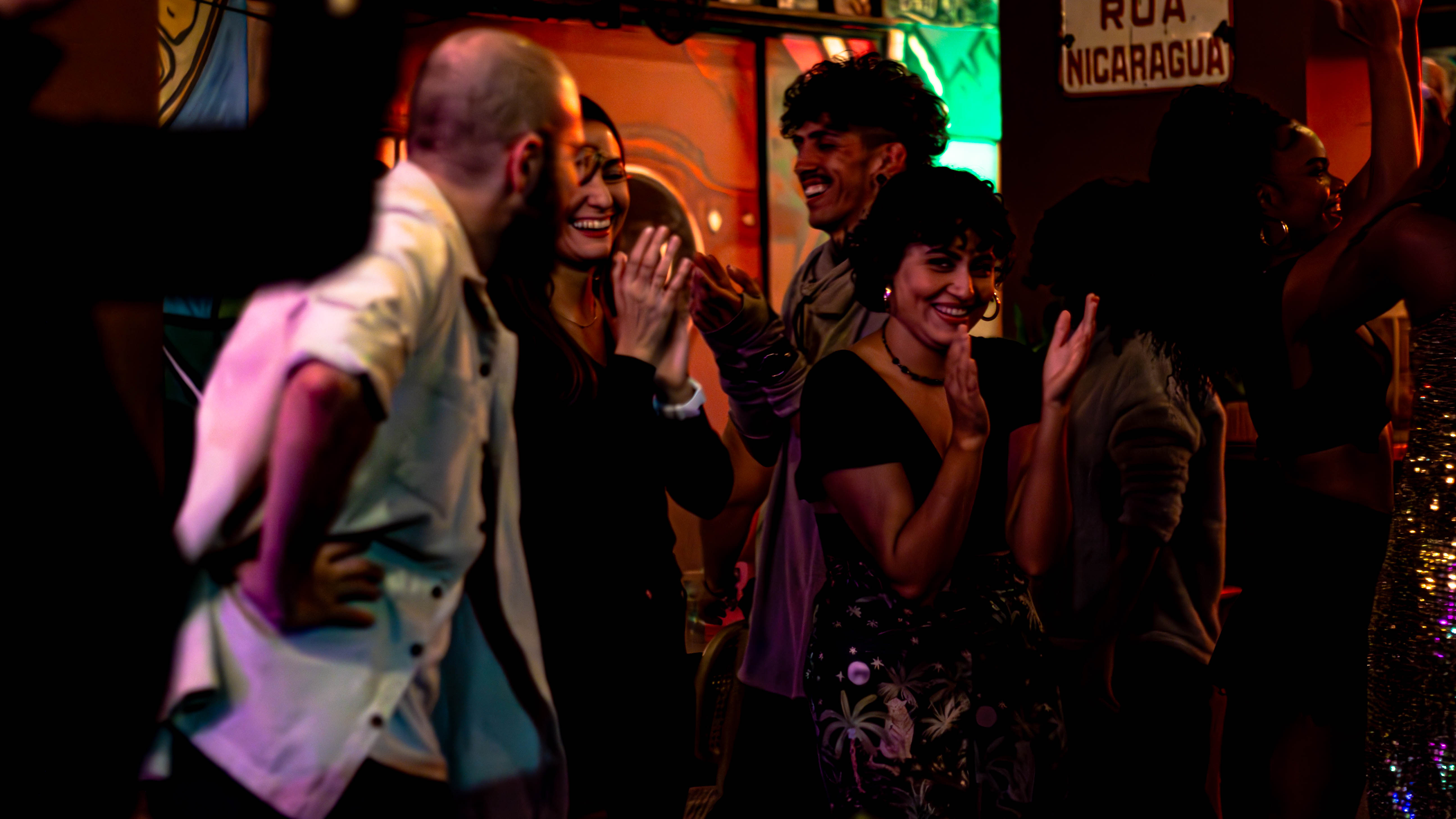 Group of new friends toasting in Buenos Aires